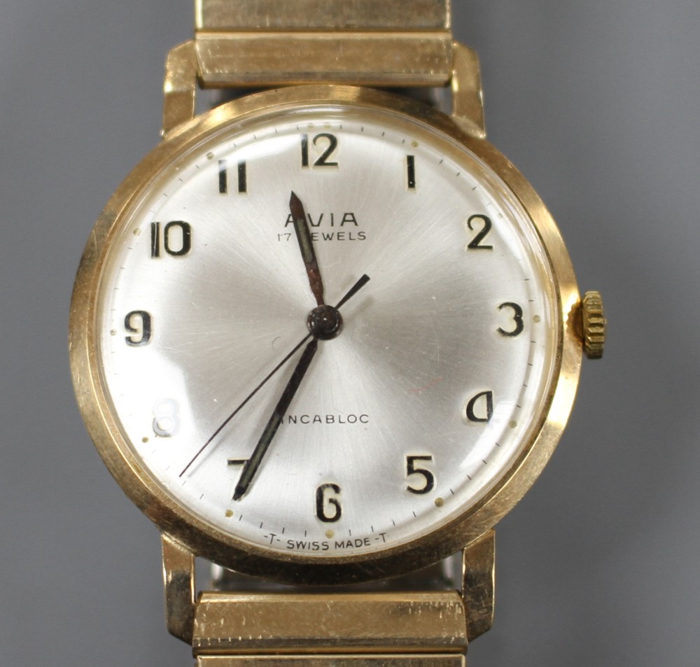 A gentlemans 1960s 9ct gold Avia manual wind wrist watch, on a gold plated strap, with Avia box.